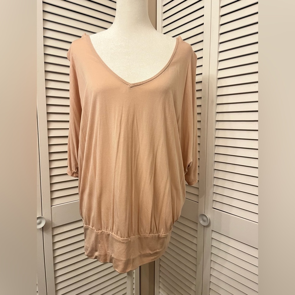 Billowing blouse fitted waist open back